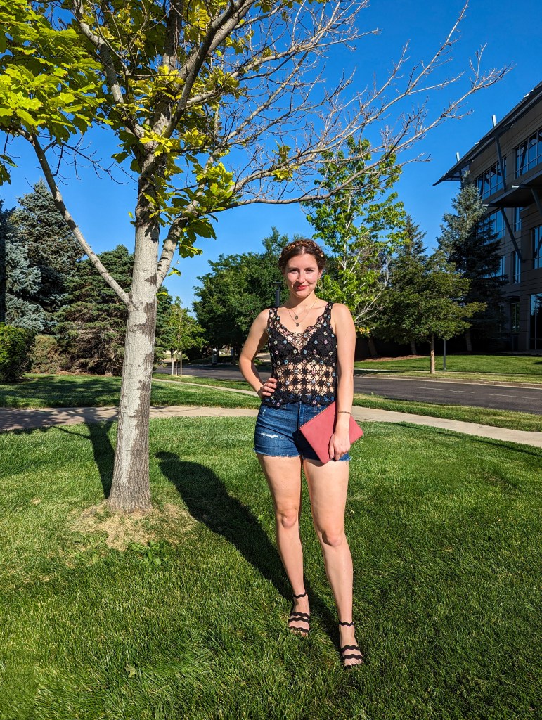 black-crochet-top-frida-kahlo-inspired-braided-updo-denim-shorts
