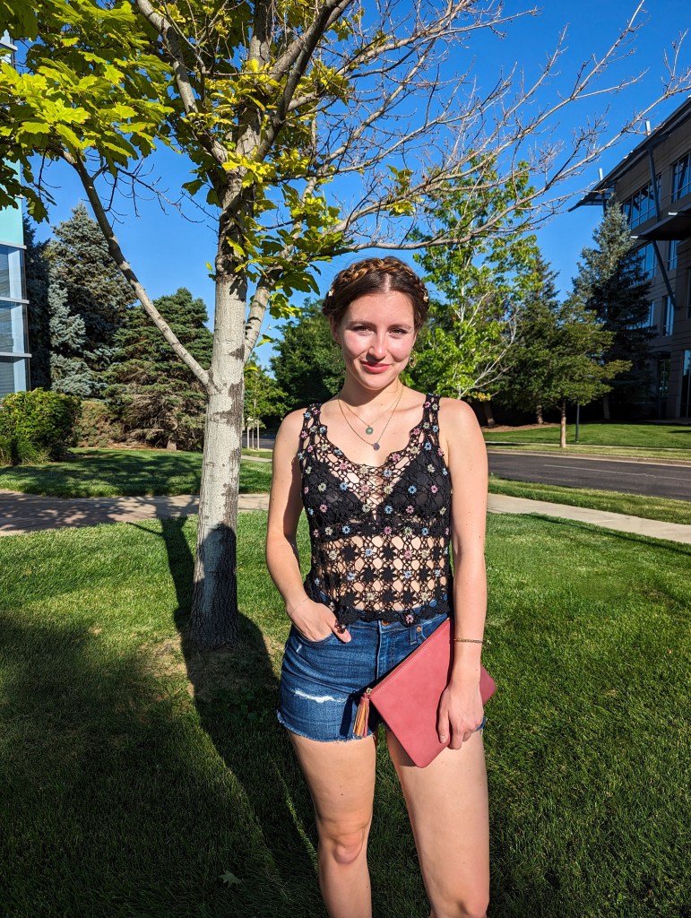 black-beaded-crochet-top-denim-shorts-braided-updo-hair-rings