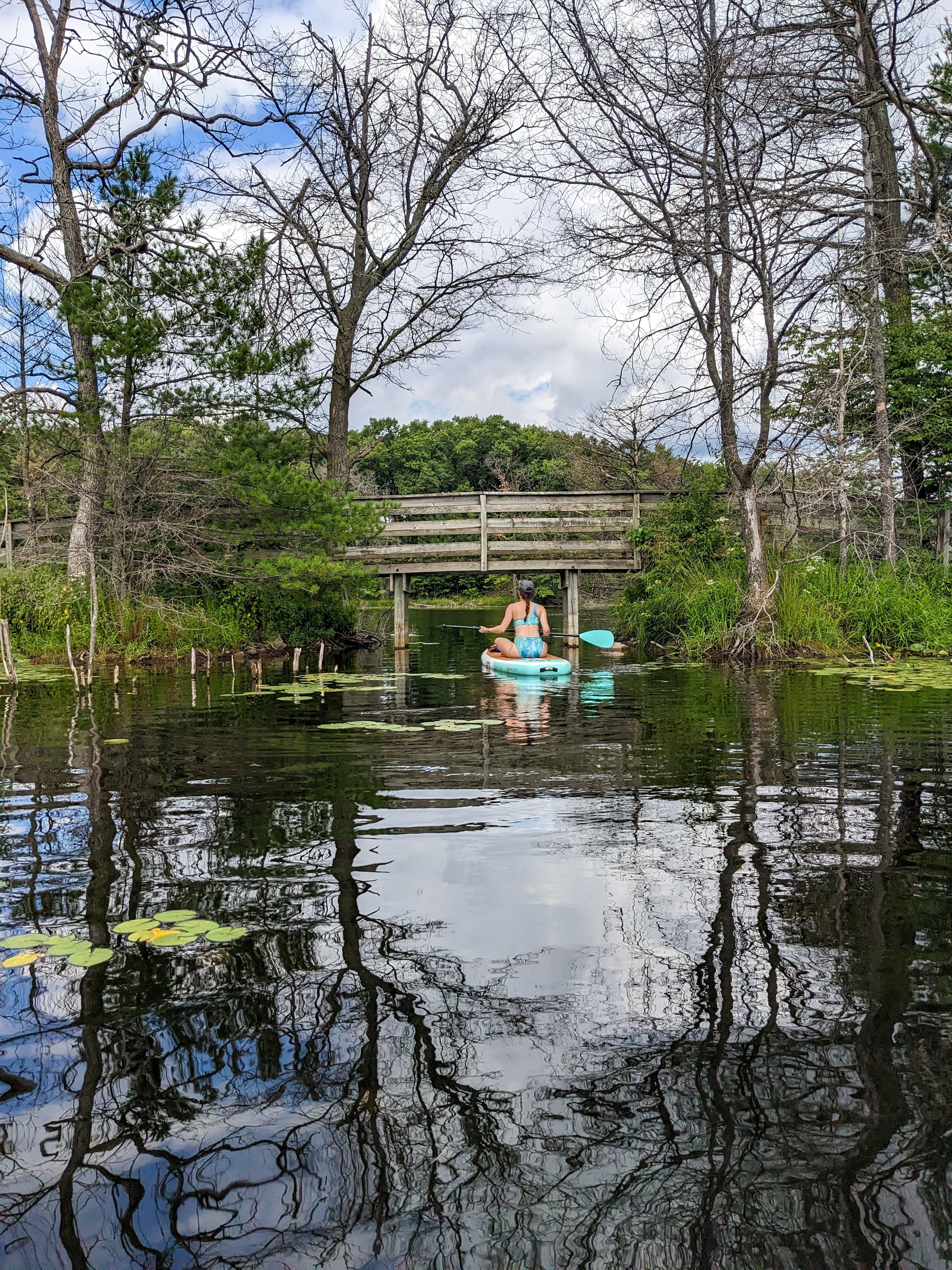 paddle-boarding-asymmetric-swimsuit-lake-wisconsin-camping-lake-day