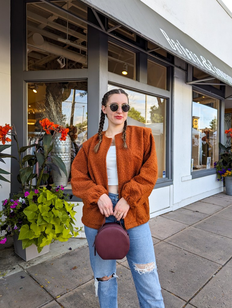 orange-coat-white-crop-top-straight-leg-jeans-maroon-circle-purse-fall-colors