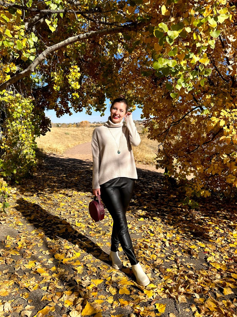 leather-pants-beige-ribbed-sweater-pendant-necklace-maroon-circle-purse