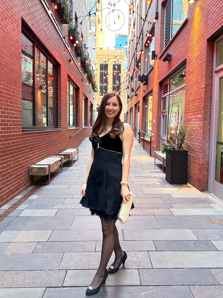 winter-wedding-fashion-black-velvet-dress-pearl-clutch-curled-hair