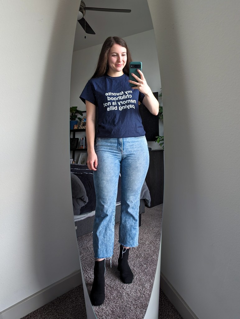 navy-tee-funny-tshirt-cropped-flared-jeans-black-booties-vivaia