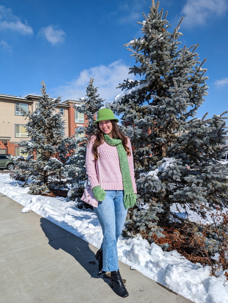 pink-sweater-green-scarf-felt-hat-brooches-cropped-flared-jeans-black-knee-boots