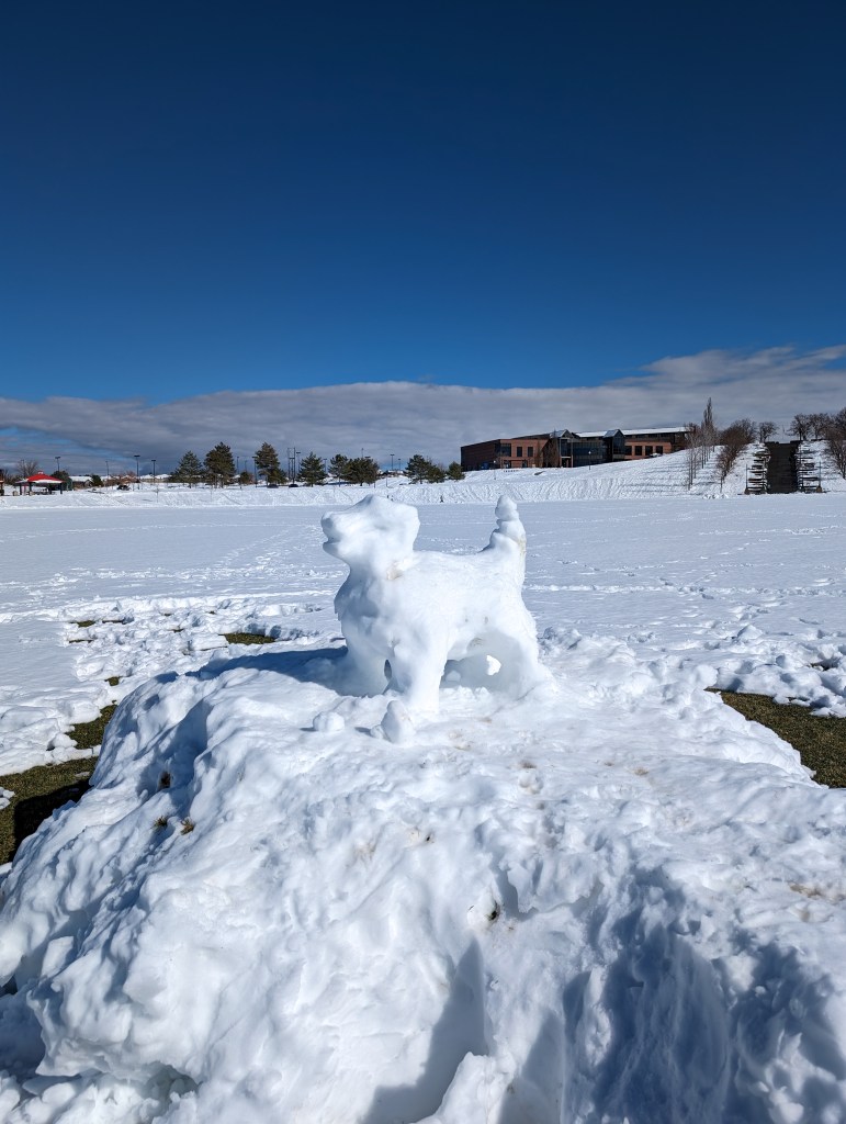 snow-day-snowstorm-city-park-dog-sculpture-snowman