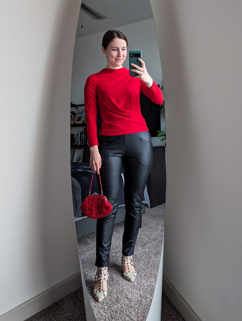 red blouse black pleather pants red beaded purse snakeskin studded heels