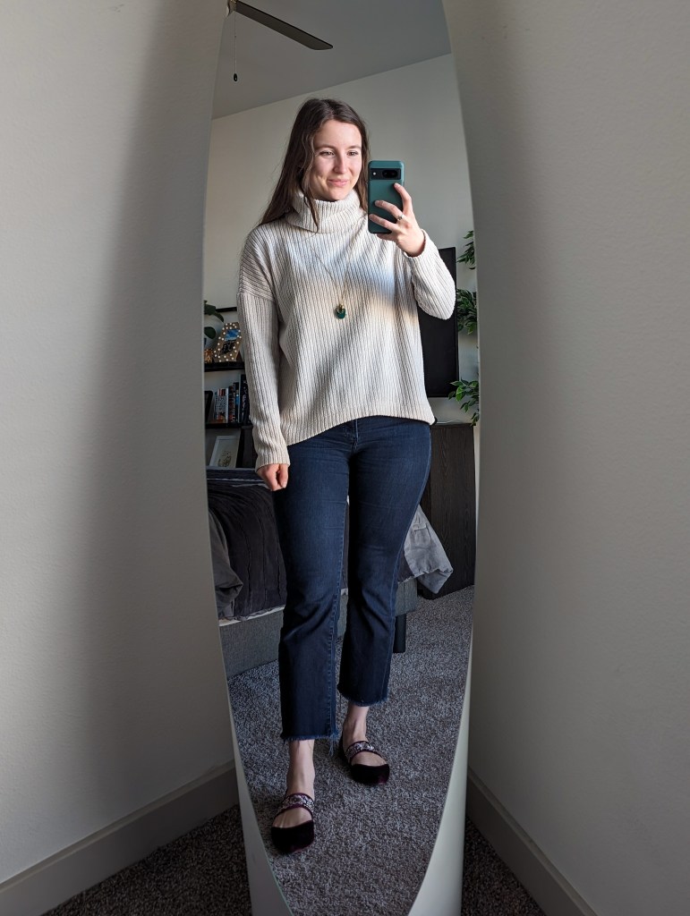 beige turtleneck ribbed sweater cropped flared dark wash jeans velvet flats
