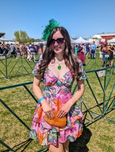 pink and green headpiece derby outfit orange beaded clutch