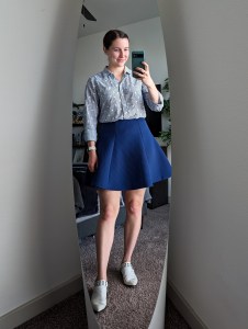 monochromatic work outfit button down blouse blue skirt white mules