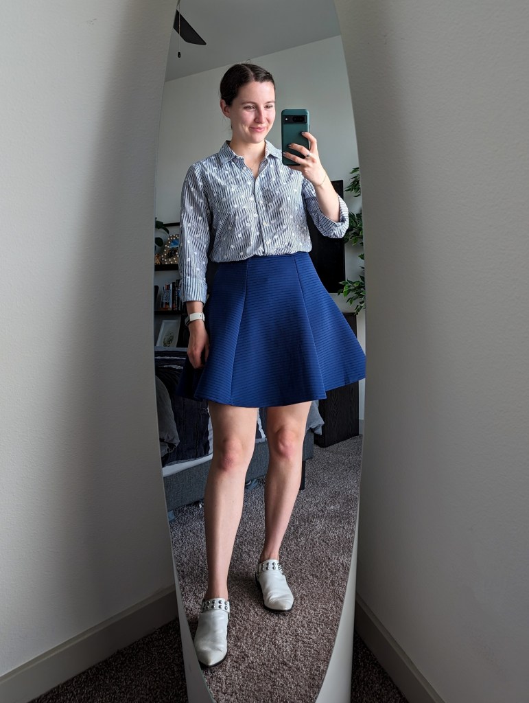 monochromatic work outfit button down blouse blue skirt white mules
