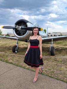 black and red polka dot dress hand-me-down striped heels WWII era planes 1940s ball
