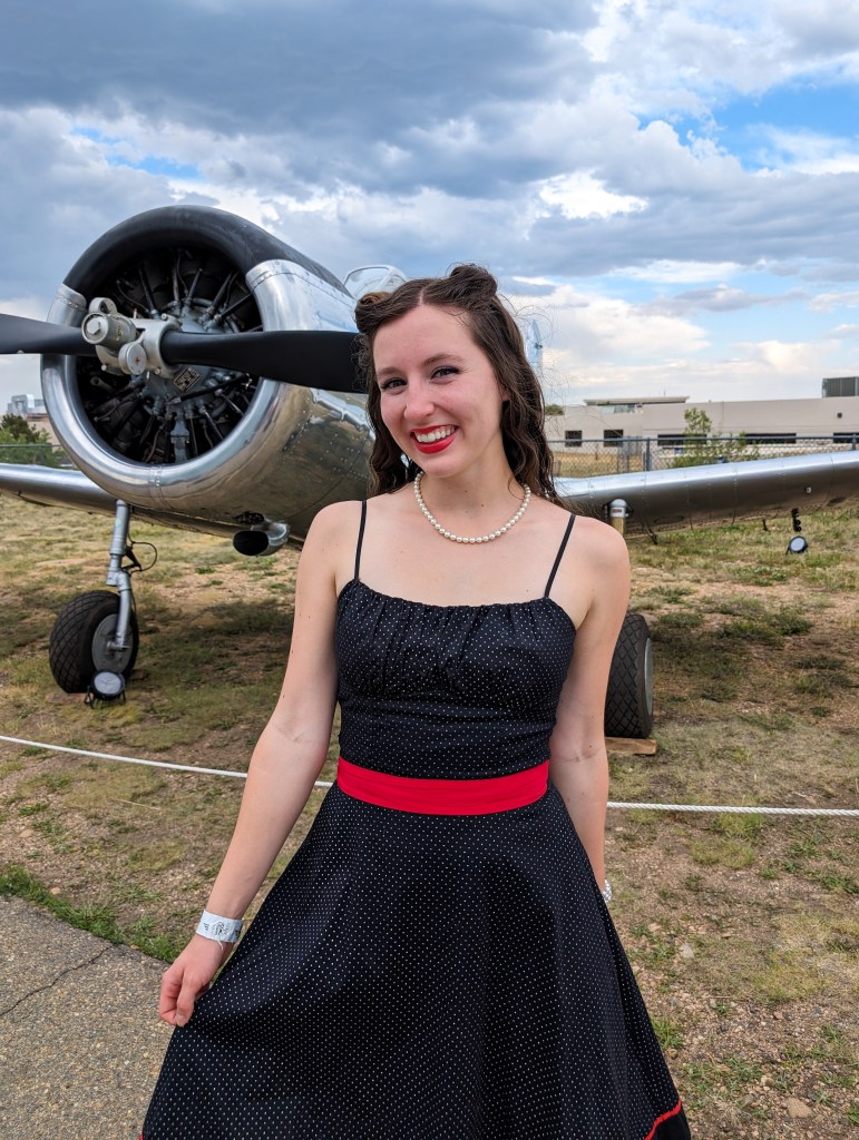 1940s ball polka dot dress retro style victory rolls pearl necklace