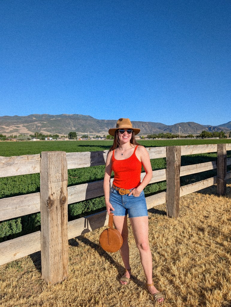 thrifted fashion affordable style cost per wear orange top panama hat sungait sunglasses