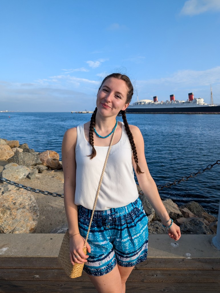 white blouse thrifted turquoise shorts summer outfit affordable fashion