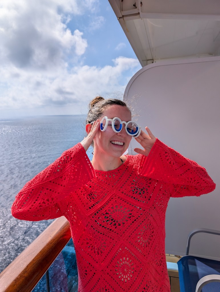 orange crochet swimsuit coverup seasickness glasses cruise ship