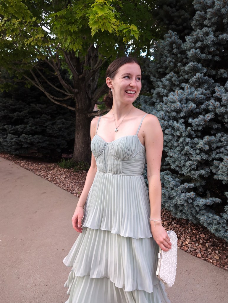 bustier pleated dress tiered bridesmaid dress sparkly earrings and necklace