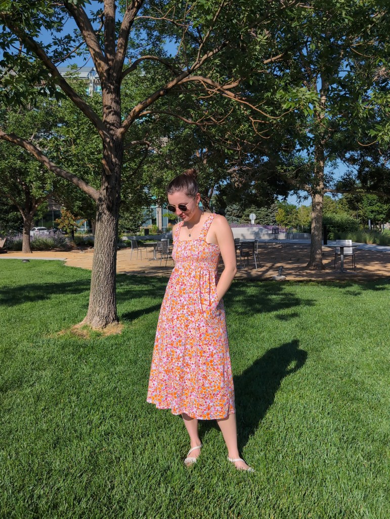 cost per wear july recap month in review floral smocked dress with pockets white sandals
