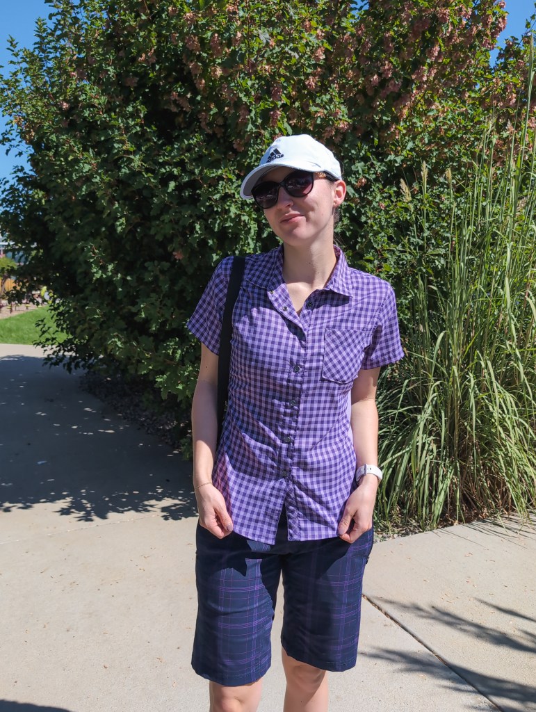 purple button down navy plaid shorts white hat club ride summer style golf outfit