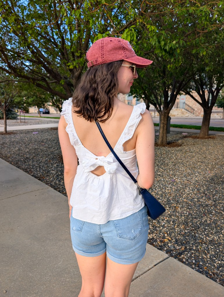 white bow back blouse red hat blue jeans summer outfit