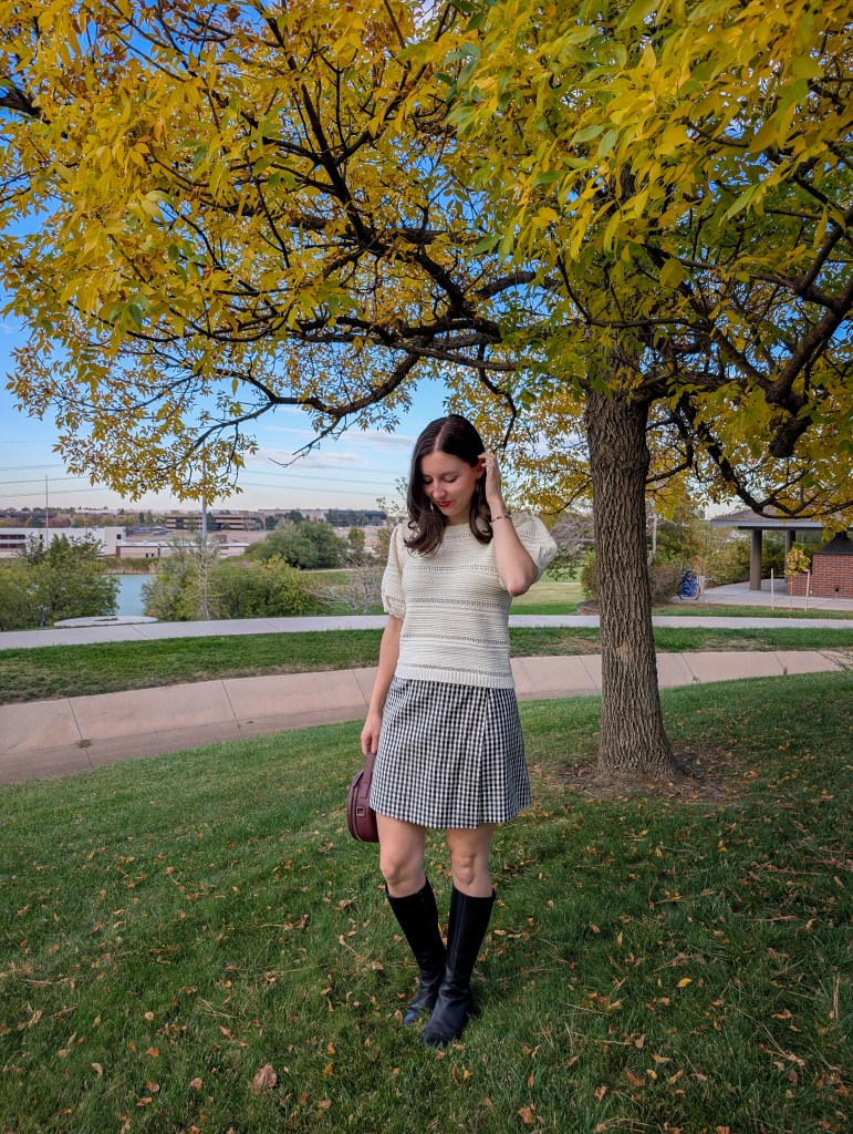 preppy fall outfit black knee boots white sweater gingham skirt